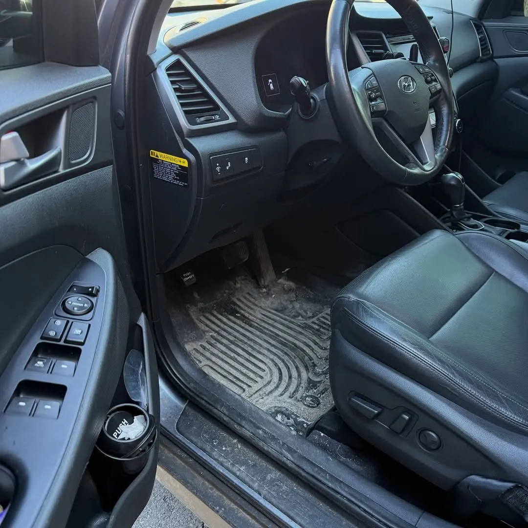 Hyundai Tucson driver floor before cleaning