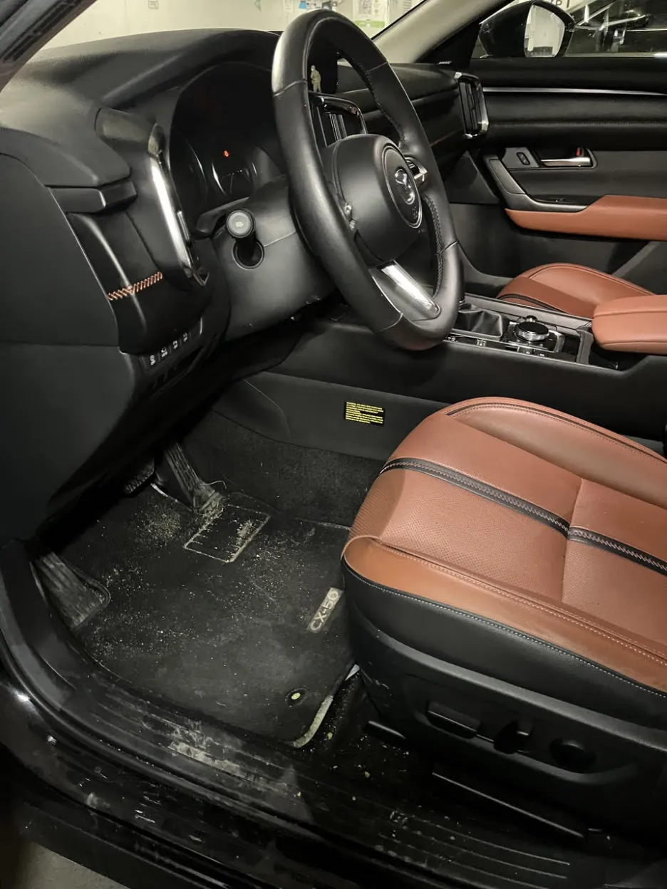 Before: Dirty Mazda CX-50 interior with dusty floor and grimy surfaces