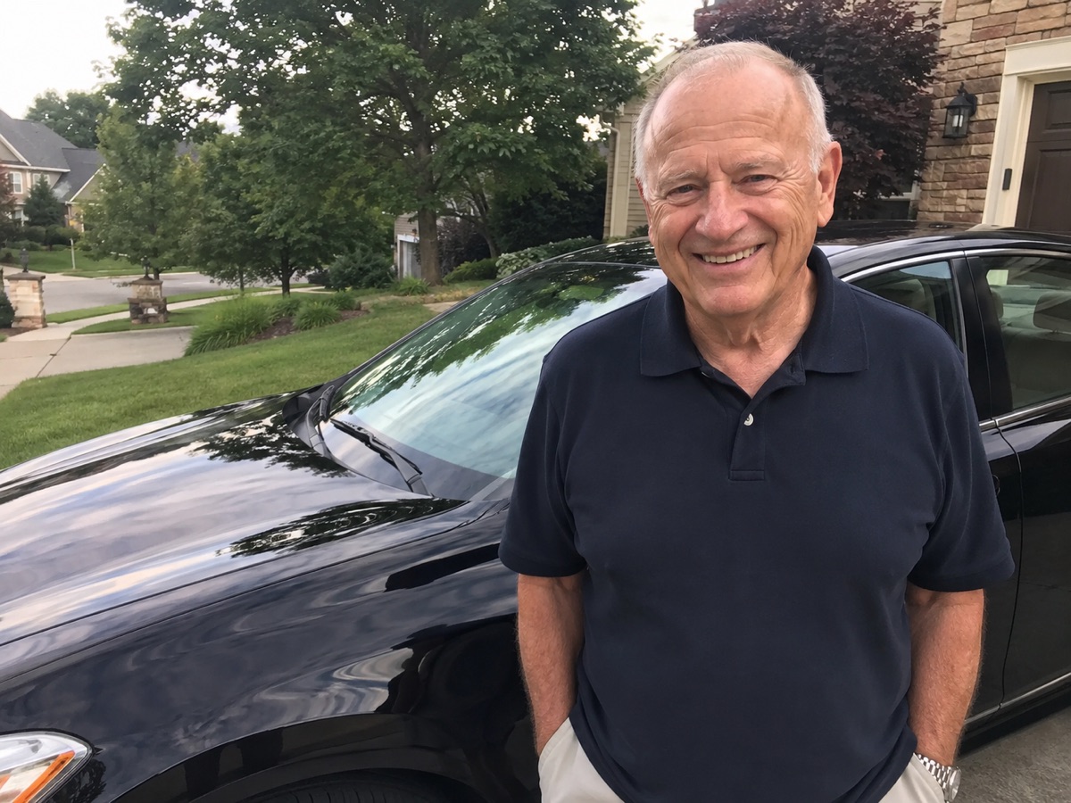 Happy senior customer with freshly detailed vehicle